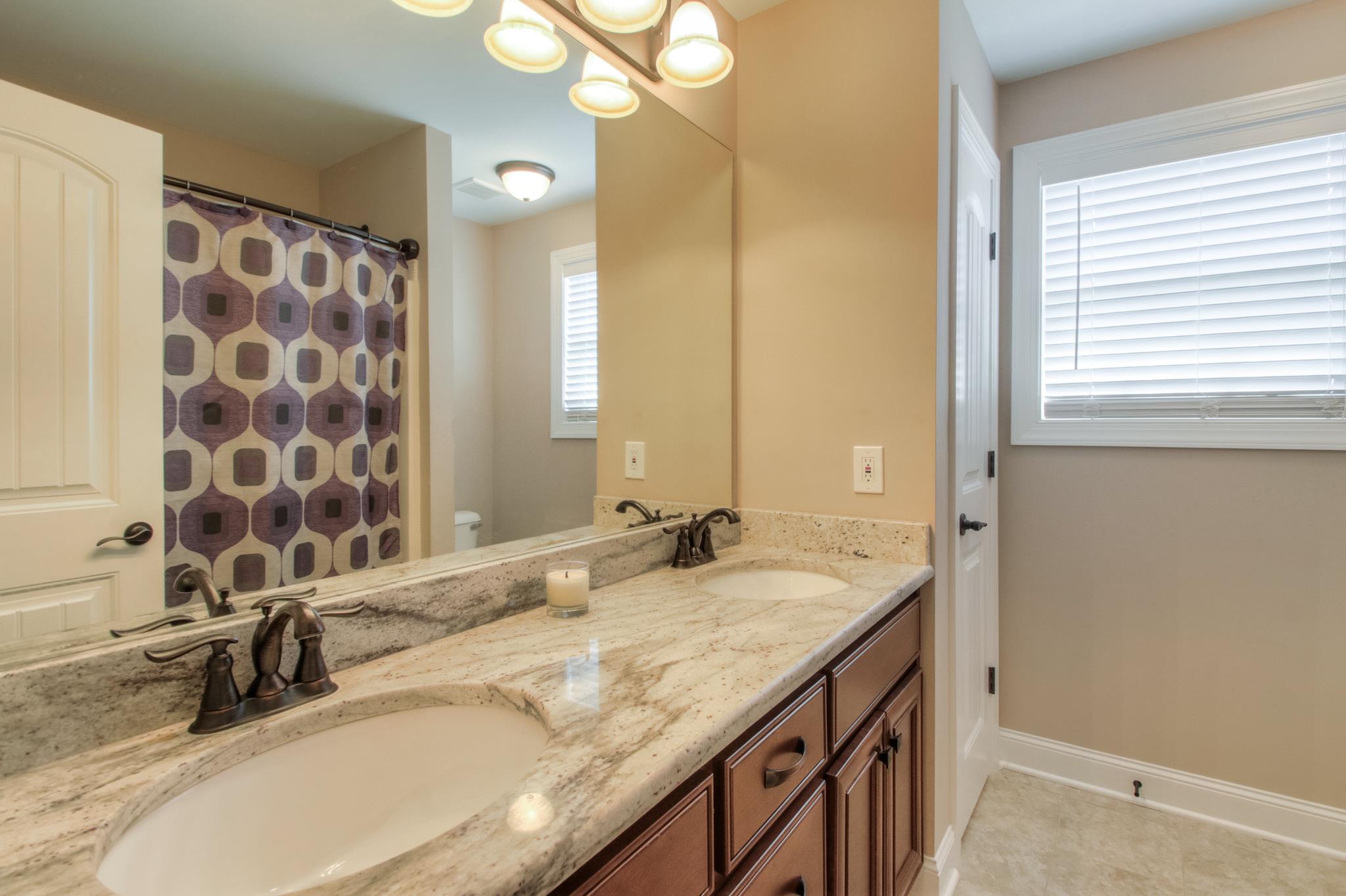 7675 Knobdate Road Smyrna, TN 37167 - Photo 20 of 26 Even the full bath upstairs has a granite double vanity and a tub/shower combination.