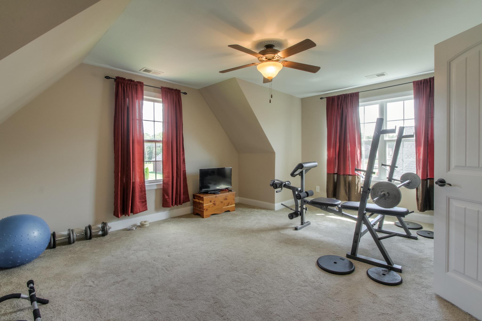 7675 Knobdate Road Smyrna, TN 37167 - Photo 21 of 26 The owner uses the bonus room as his weight room but there's plenty of room for whatever you have in store.