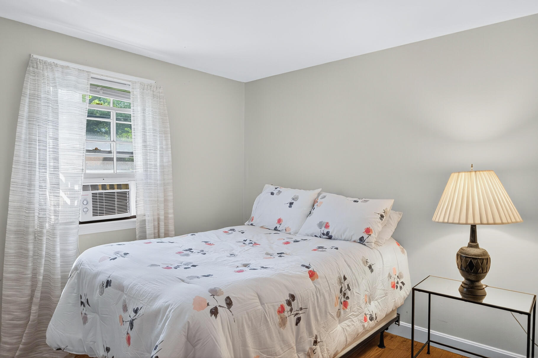 101 Longfellow Drive Centerville, MA 02632 - Photo 17 of 27 a bedroom with a bed and a lamp