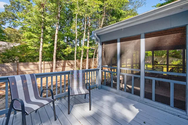a view of a chairs on the roof deck