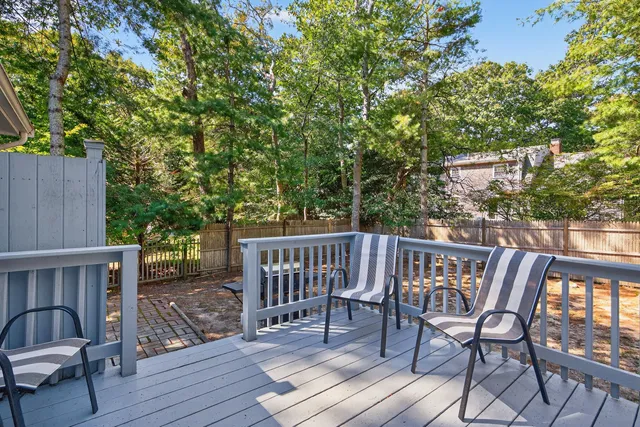 a view of a chairs and table on the deck
