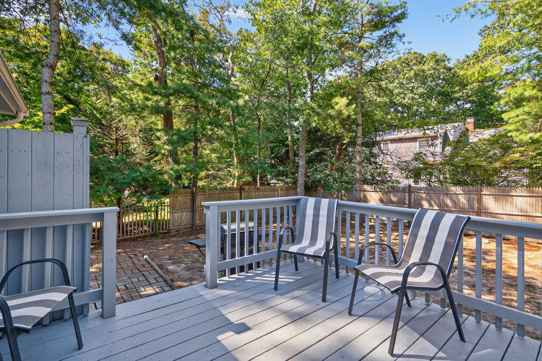 101 Longfellow Drive Centerville, MA 02632 - Photo 22 of 27 a view of a chairs and table on the deck
