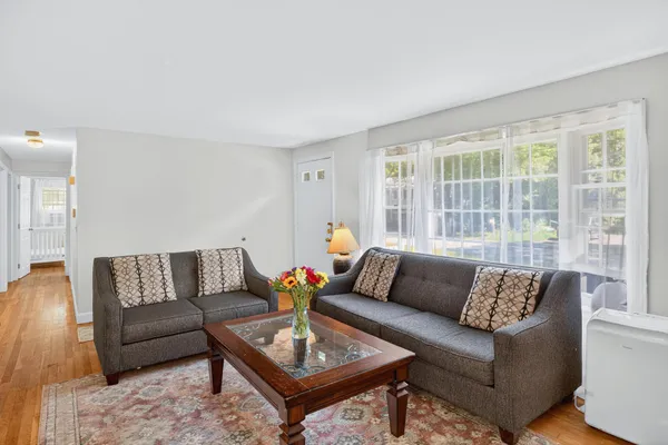 a living room with furniture and a large window