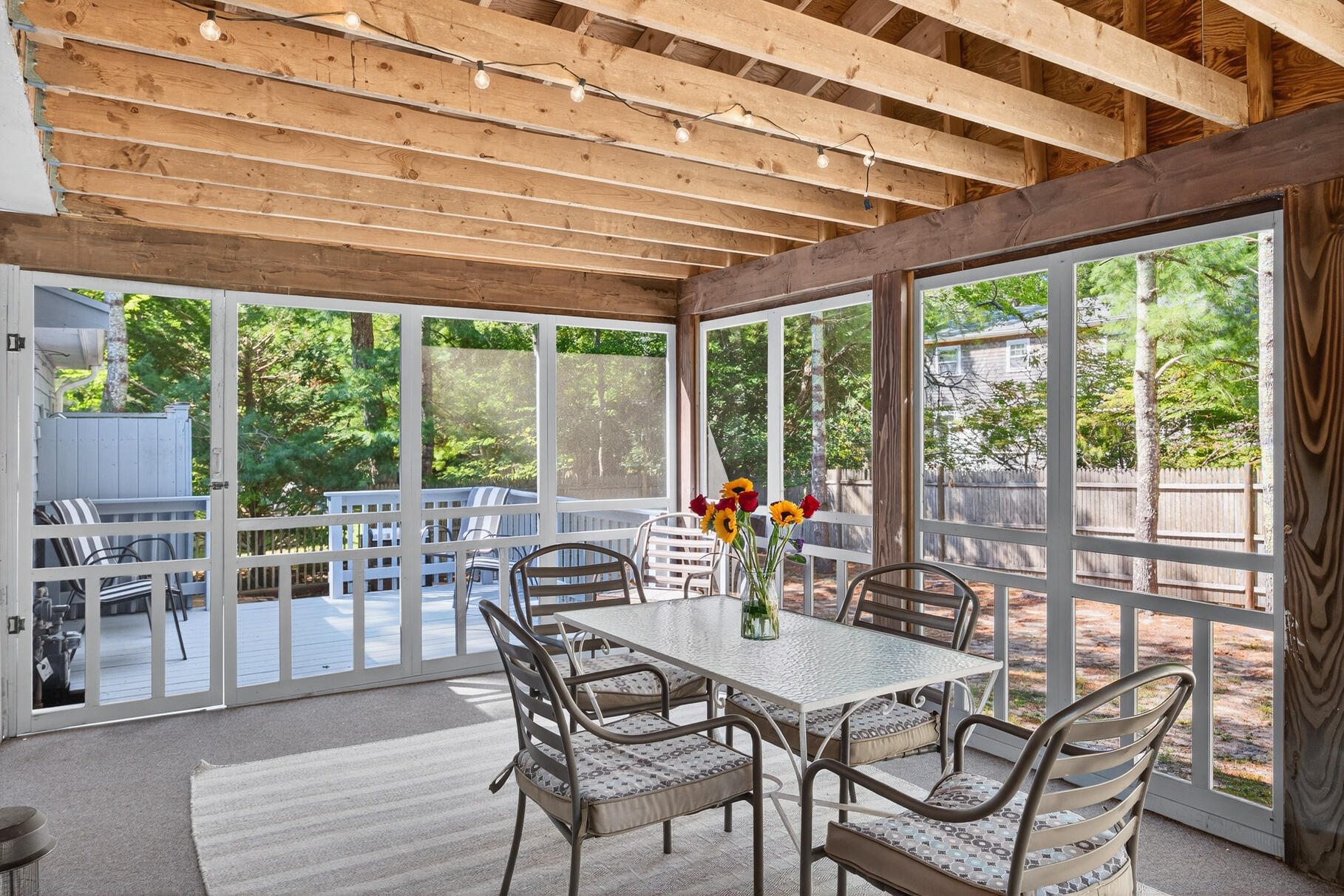 101 Longfellow Drive Centerville, MA 02632 - Photo 8 of 27 a dining room with furniture and a floor to ceiling window