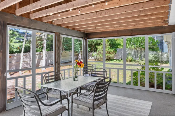 a view of a dining room with furniture window and outside view