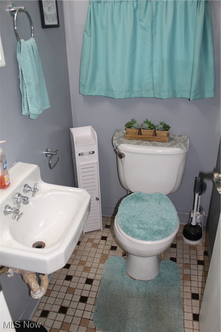 1292 Ford Road Lyndhurst, OH 44124 - Photo 23 of 25 Bathroom featuring sink, tile floors, and toilet