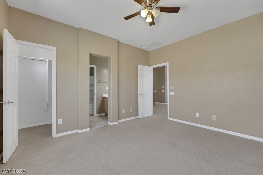 2501 Bechamel Place Henderson, NV 89044 - Photo 27 of 50 A quiet retreat featuring a ceiling fan and a soft carpeted floor.