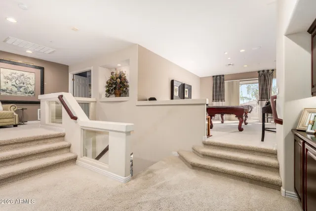 a spacious en suite bathroom with a sink and mirror
