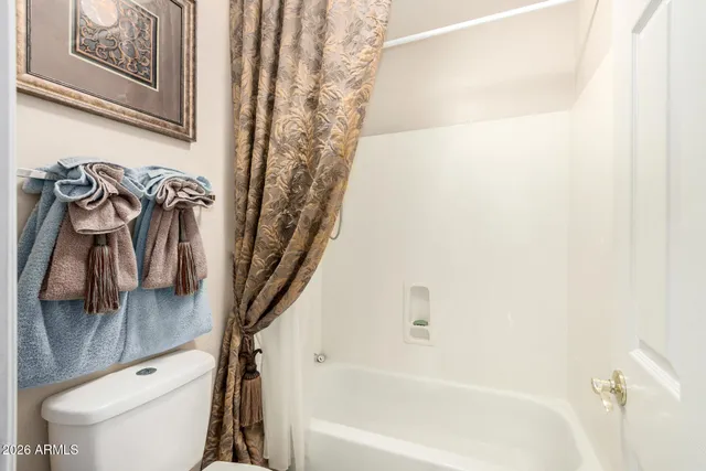 a view of a street with a building in the background