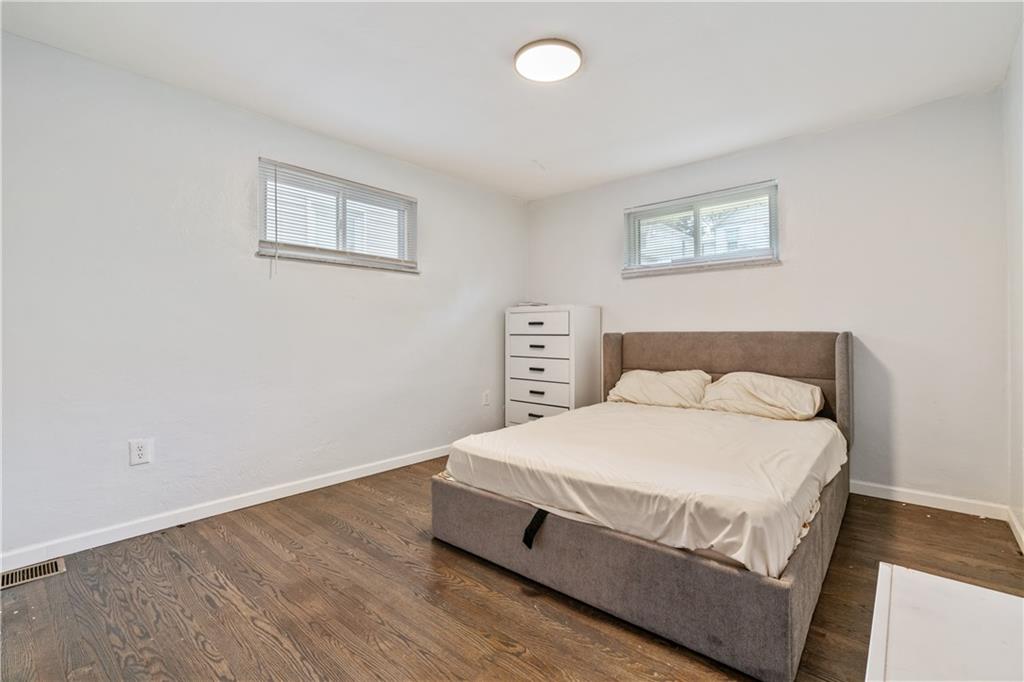 2429 Perry Street Munhall, PA 15120 - Photo 14 of 23 a large bed sitting in a bedroom and a table