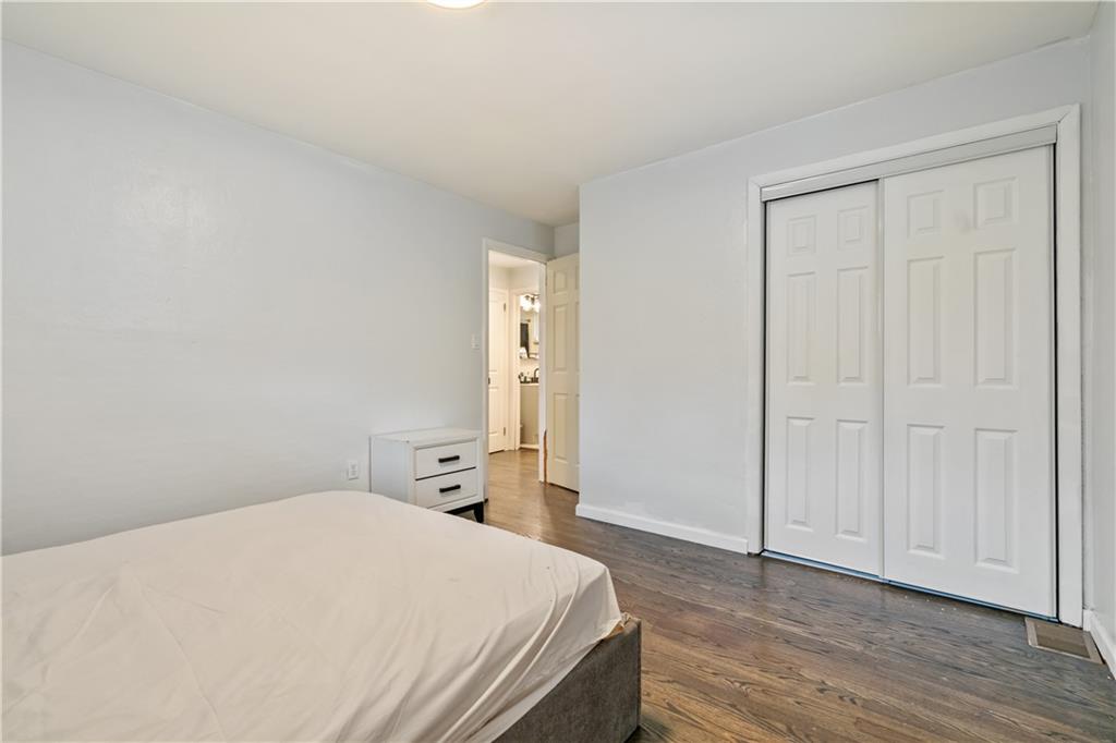 2429 Perry Street Munhall, PA 15120 - Photo 15 of 23 a bedroom with a bed and wooden floor