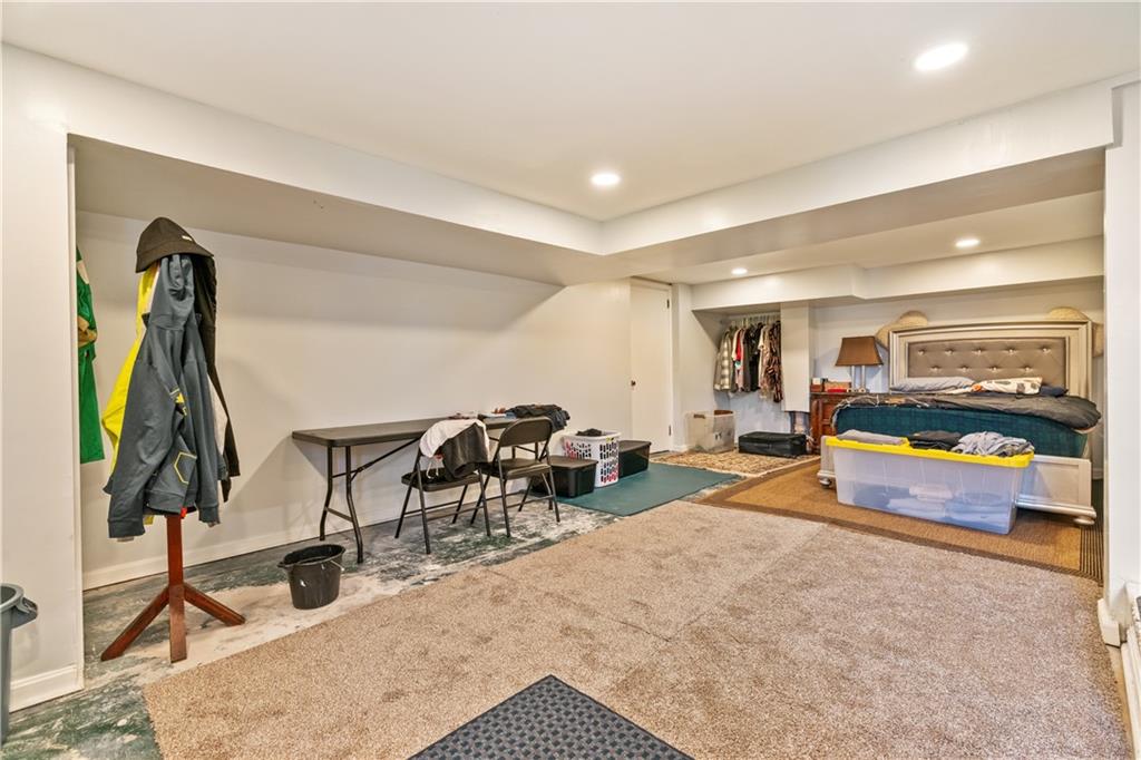 2429 Perry Street Munhall, PA 15120 - Photo 17 of 23 a living room with furniture gym equipment and a rug