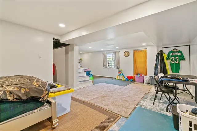 a bathroom with a sink mirror and toilet