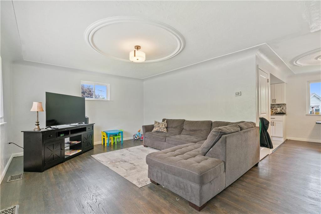 2429 Perry Street Munhall, PA 15120 - Photo 3 of 23 a living room with furniture and a flat screen tv