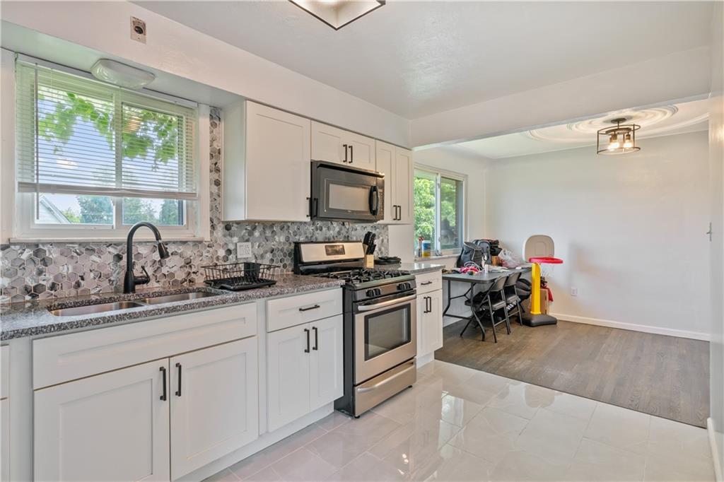 2429 Perry Street Munhall, PA 15120 - Photo 8 of 23 a kitchen with a sink cabinets and a window
