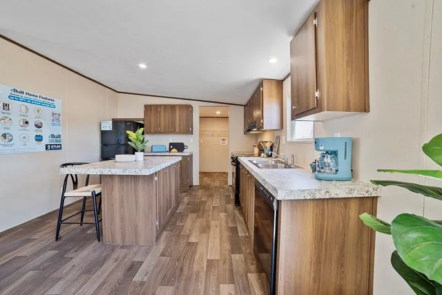a kitchen with a sink a counter top space and appliances
