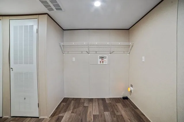 a view of small space with racks on the wall