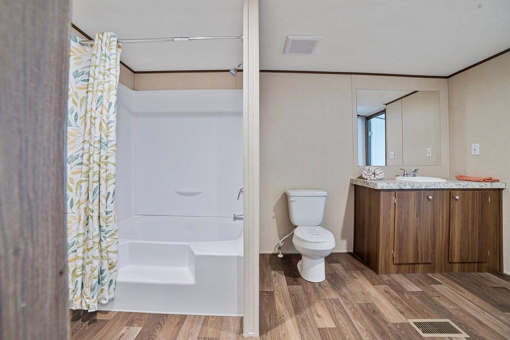 284 Pine Grove Road Gordonville, TX 76245 - Photo 21 of 29 a bathroom with a toilet and a shower