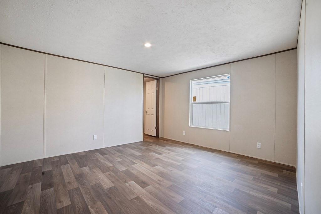 284 Pine Grove Road Gordonville, TX 76245 - Photo 26 of 29 a view of an empty room with wooden floor