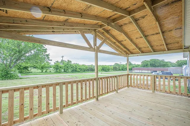 a view of balcony with wooden floor