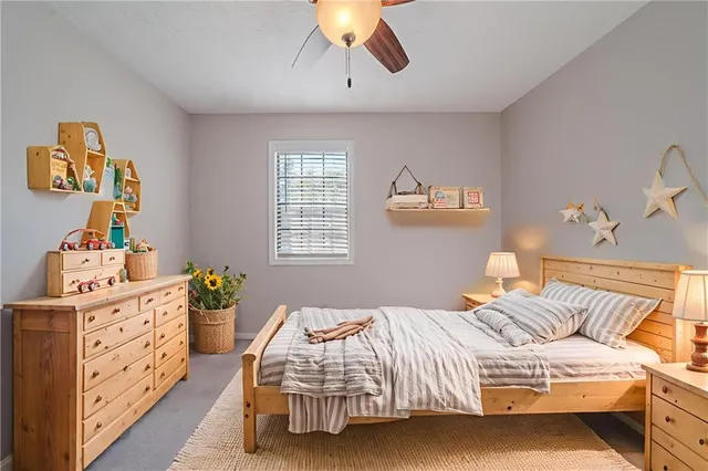 a bedroom with a bed and window