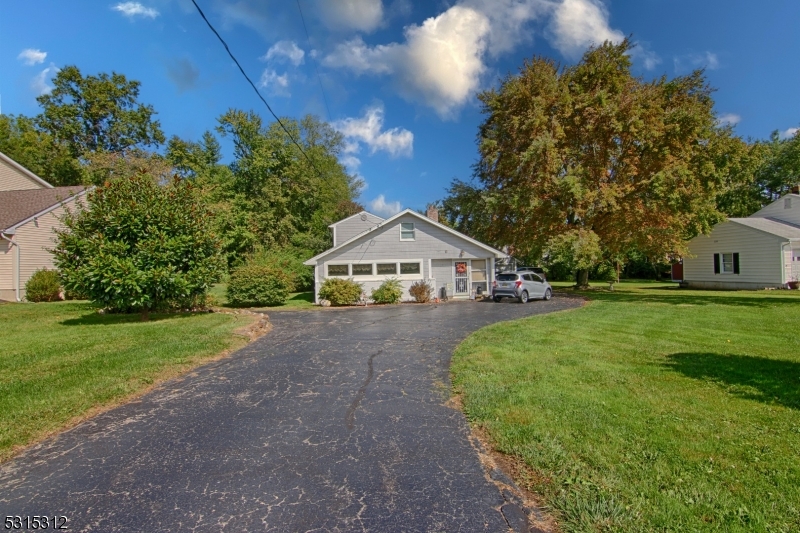 96 Parsippany Road Whippany, NJ 07981 - Photo 6 of 12 a view of a house with garden and trees
