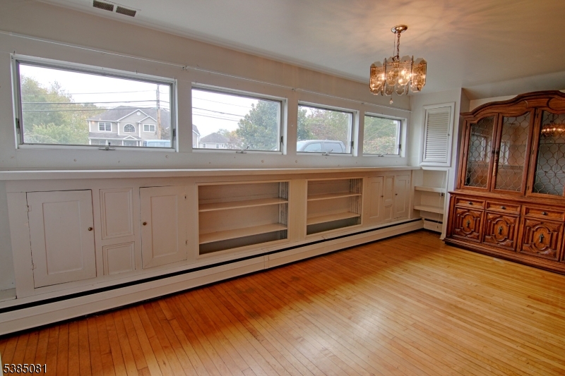 96 Parsippany Road Whippany, NJ 07981 - Photo 8 of 12 a view of an empty room with wooden floor and a window