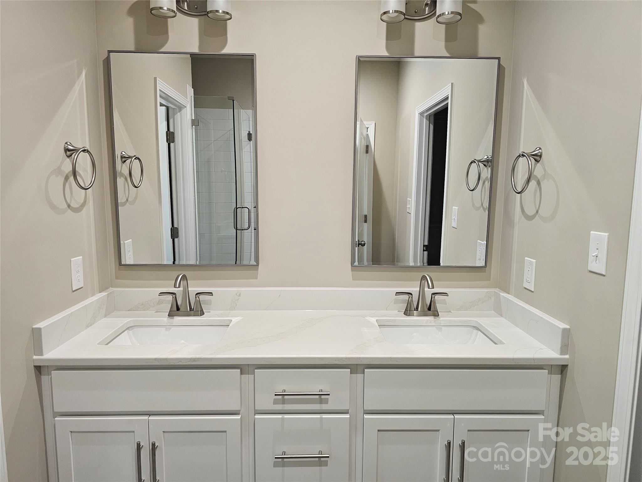 3679 Travertine Drive Lancaster, SC 29720 - Photo 11 of 26 a bathroom with double sink and a mirror