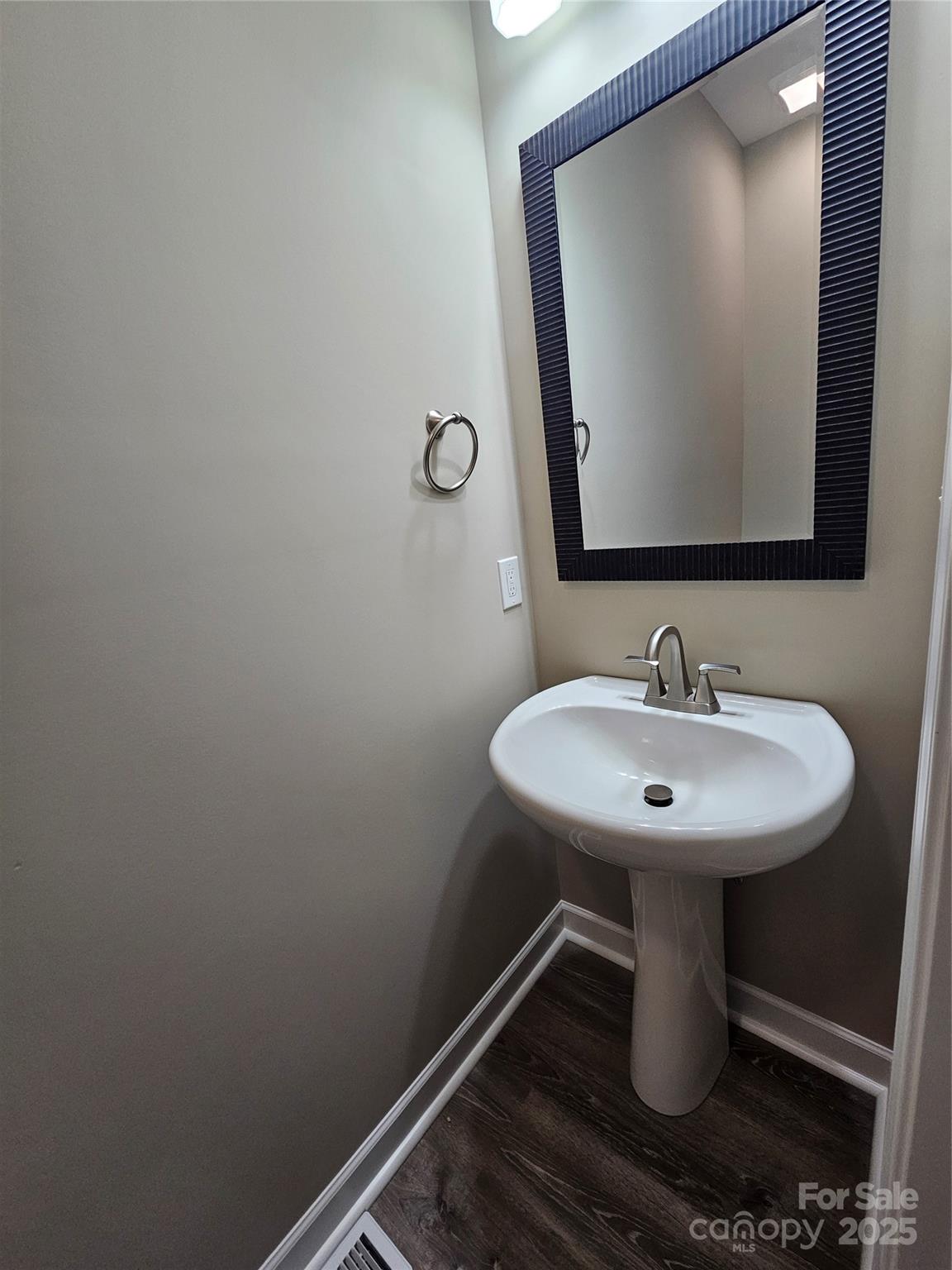 3679 Travertine Drive Lancaster, SC 29720 - Photo 14 of 26 a bathroom with a sink and mirror