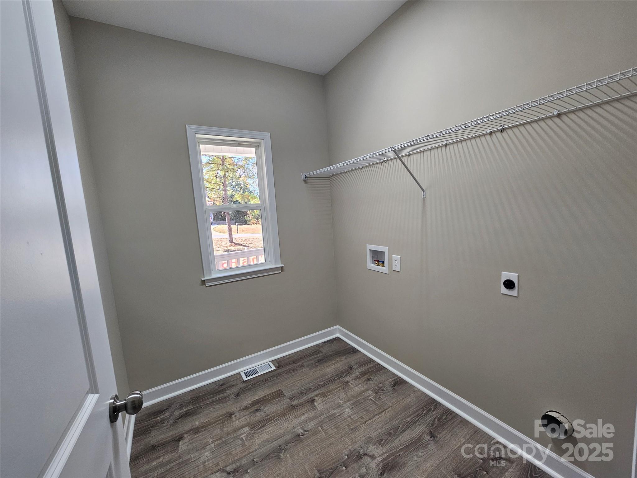 3679 Travertine Drive Lancaster, SC 29720 - Photo 15 of 26 a view of an empty room with wooden floor and a window