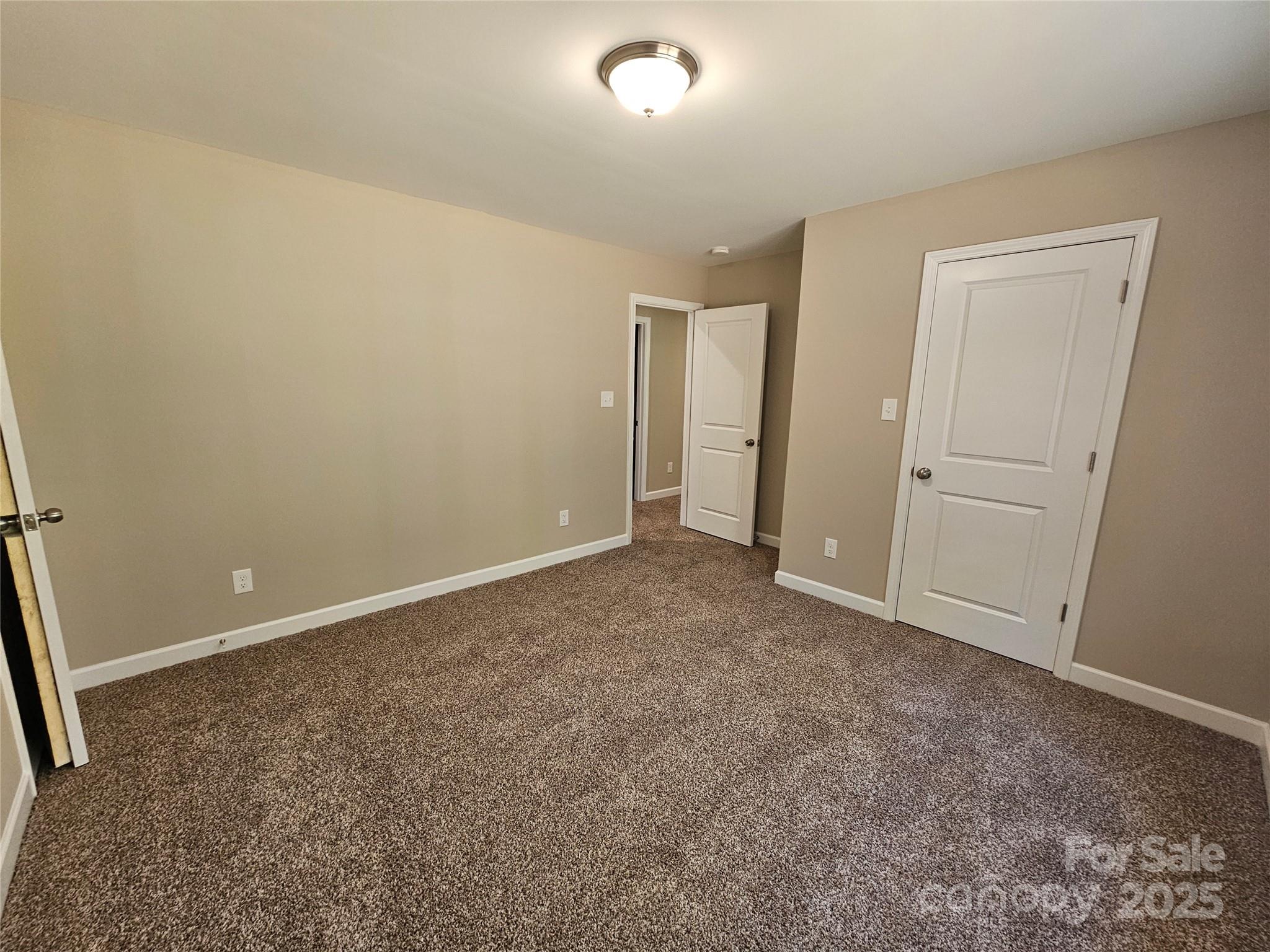 3679 Travertine Drive Lancaster, SC 29720 - Photo 23 of 26 an empty room with closet and a bathroom