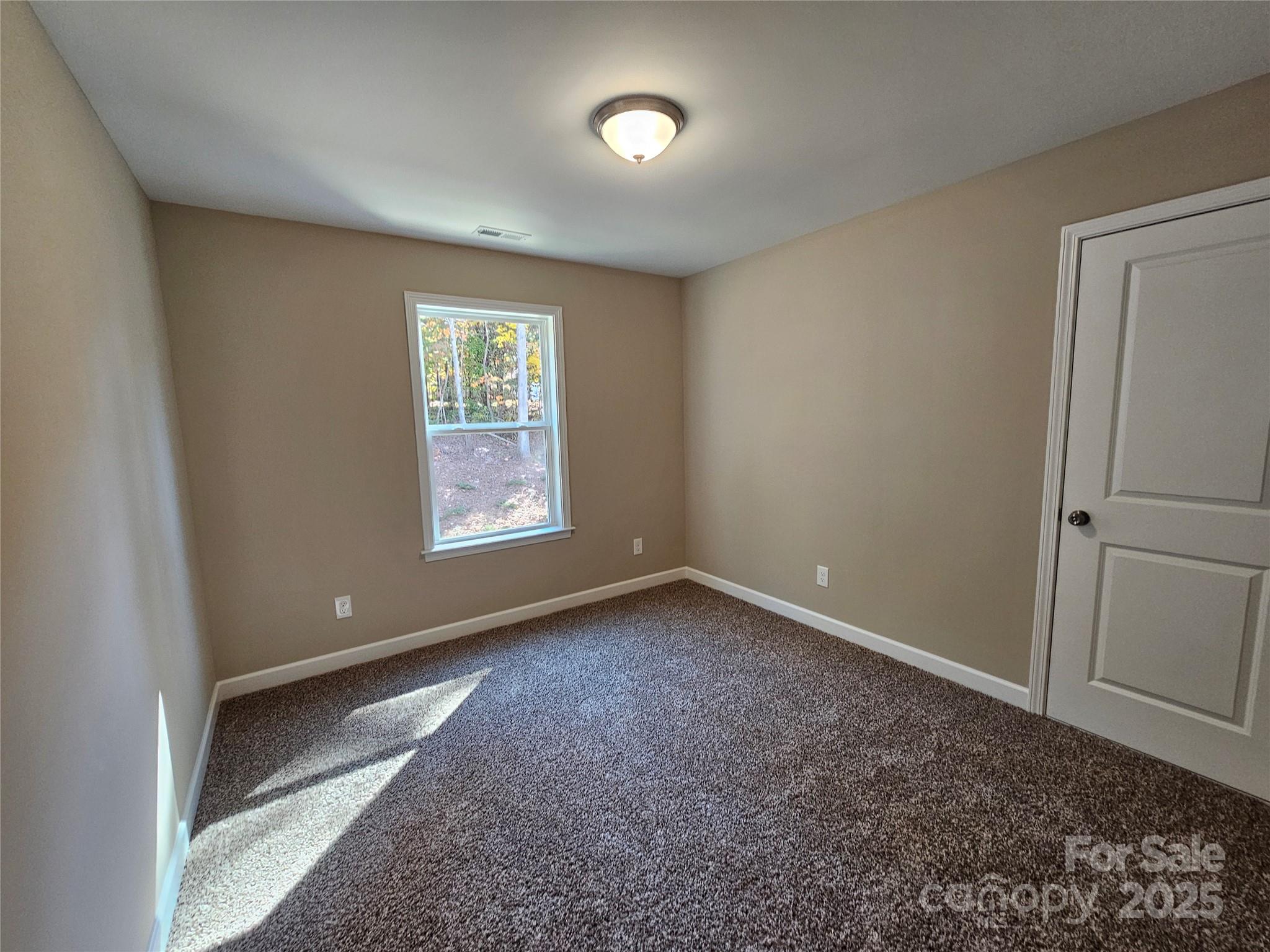 3679 Travertine Drive Lancaster, SC 29720 - Photo 24 of 26 a view of an empty room with a window and a bathroom