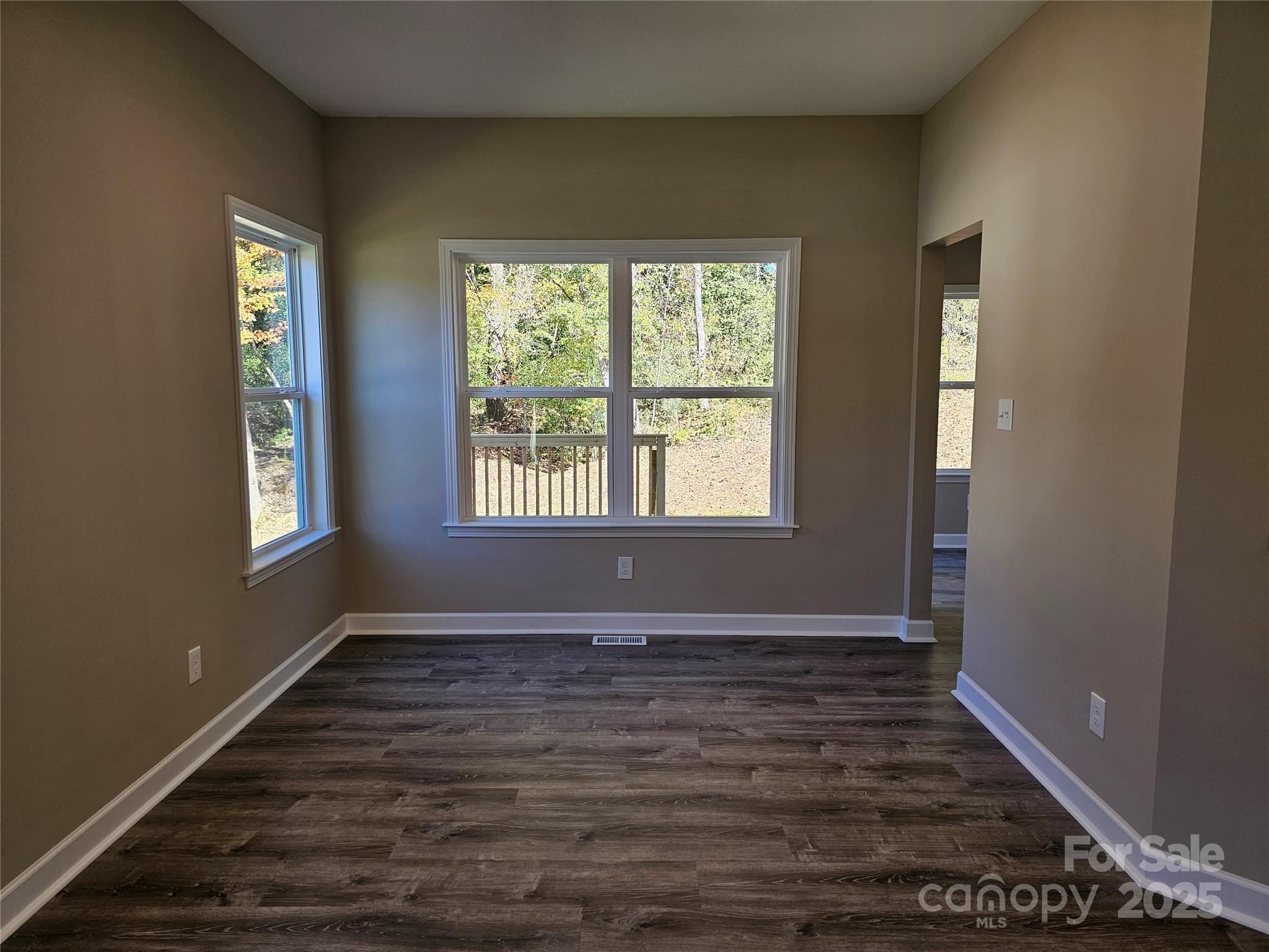 3679 Travertine Drive Lancaster, SC 29720 - Photo 5 of 26 a view of an empty room with wooden floor and a window