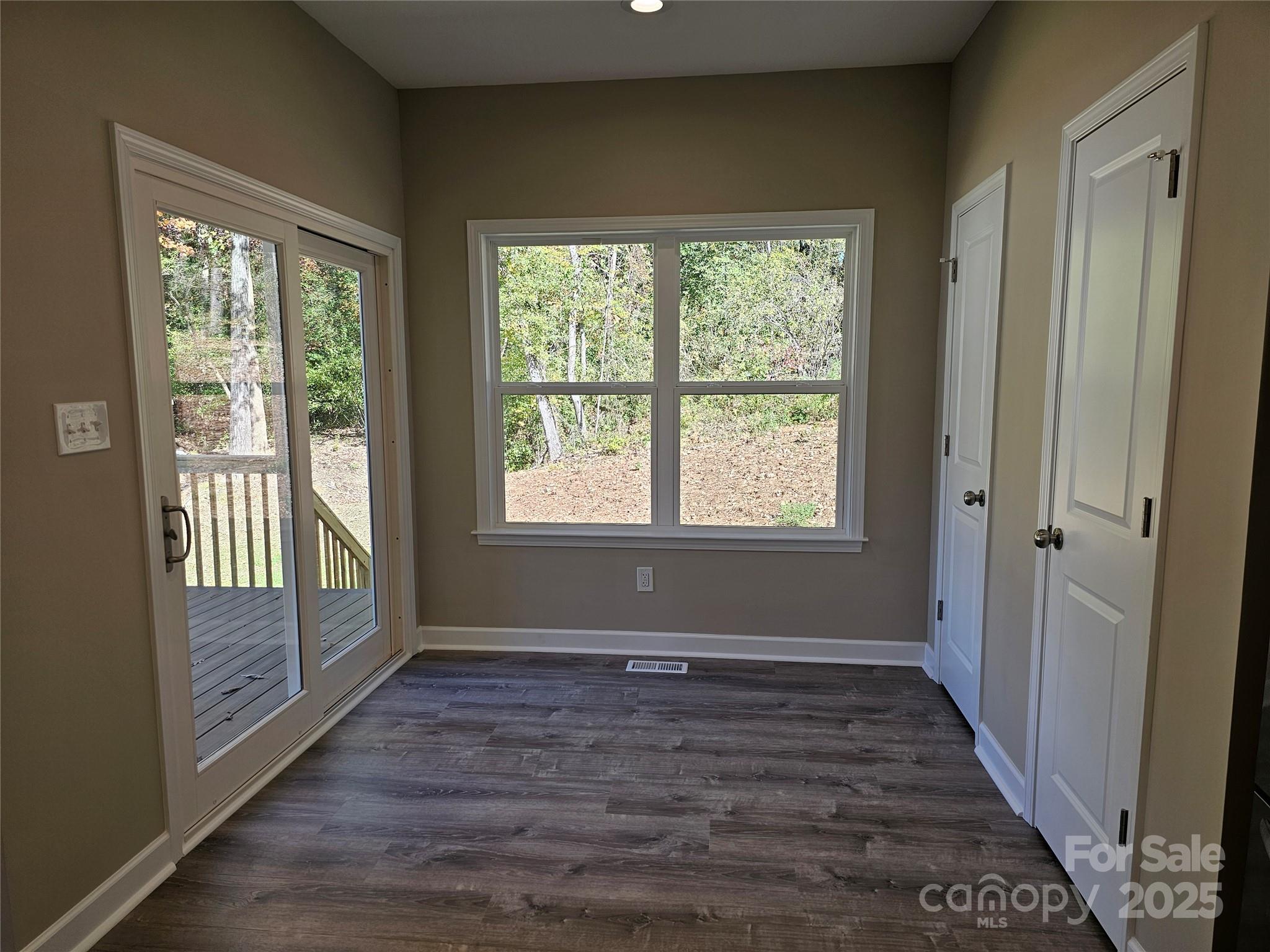 3679 Travertine Drive Lancaster, SC 29720 - Photo 8 of 26 a view of an empty room with wooden floor and a window