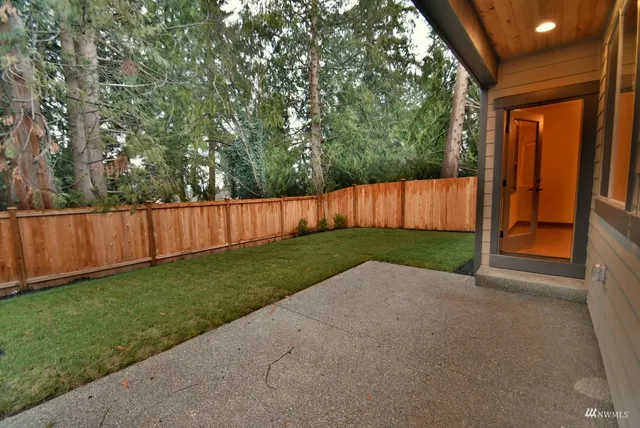 a view of backyard with green space