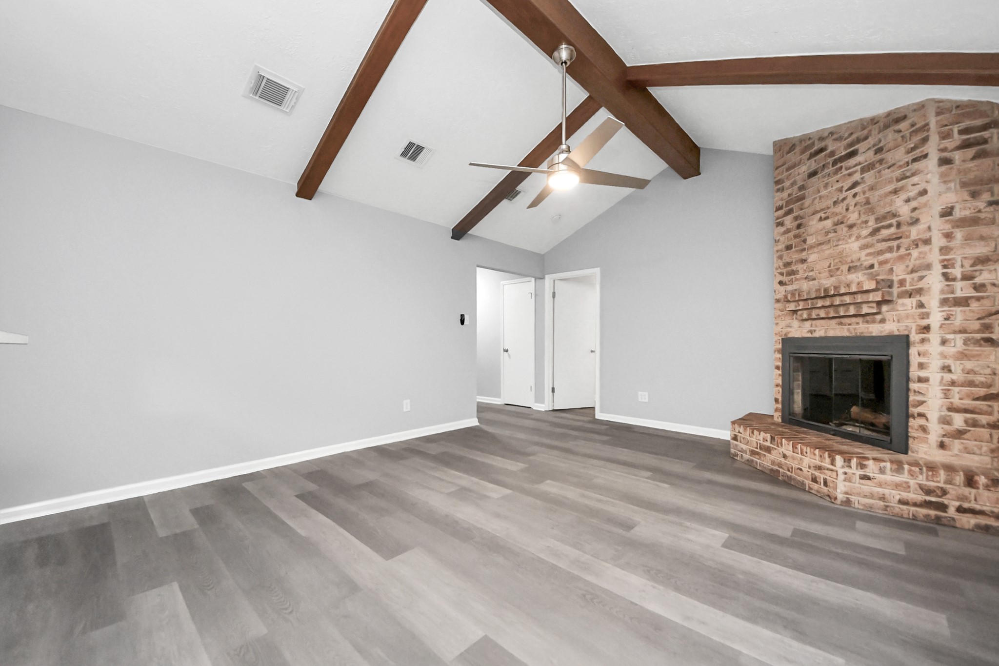 2522 Nightowl Trail Spring, TX 77373 - Photo 11 of 40 a view of empty room with stairs and a fireplace