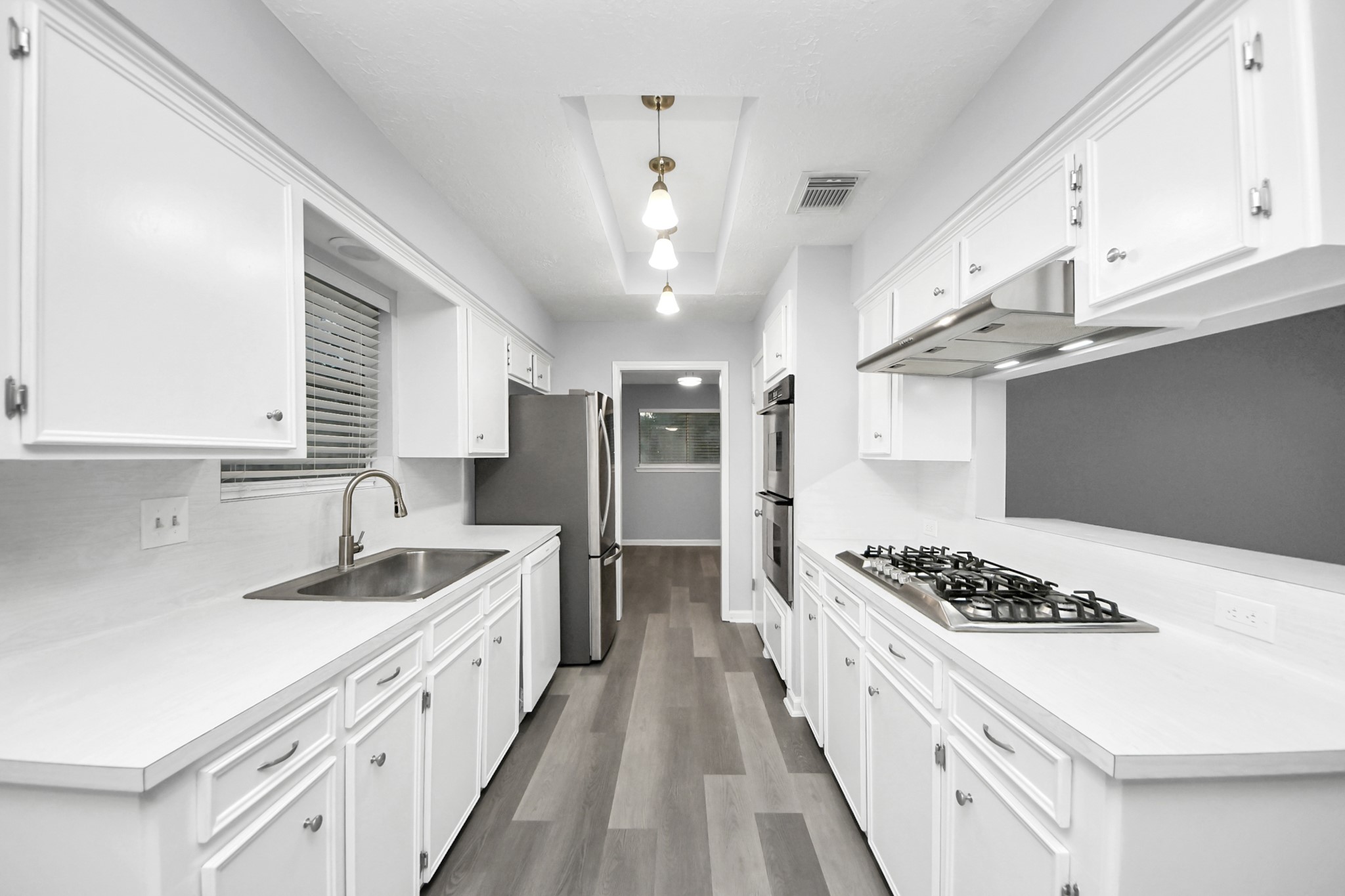2522 Nightowl Trail Spring, TX 77373 - Photo 13 of 40 a kitchen with stainless steel appliances a sink dishwasher a stove and a refrigerator