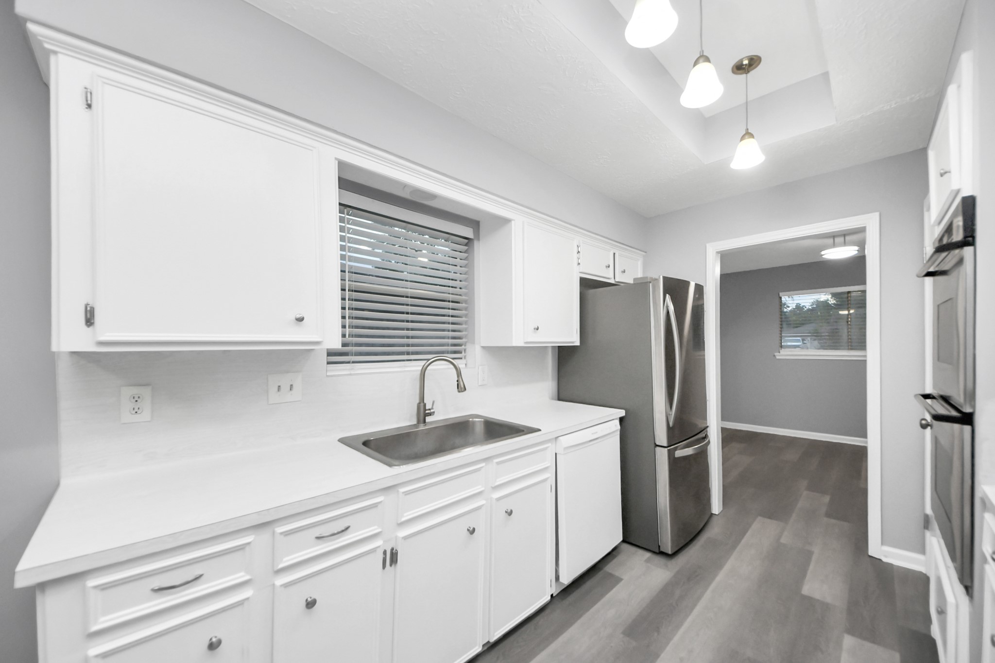 2522 Nightowl Trail Spring, TX 77373 - Photo 14 of 40 a kitchen with refrigerator and window