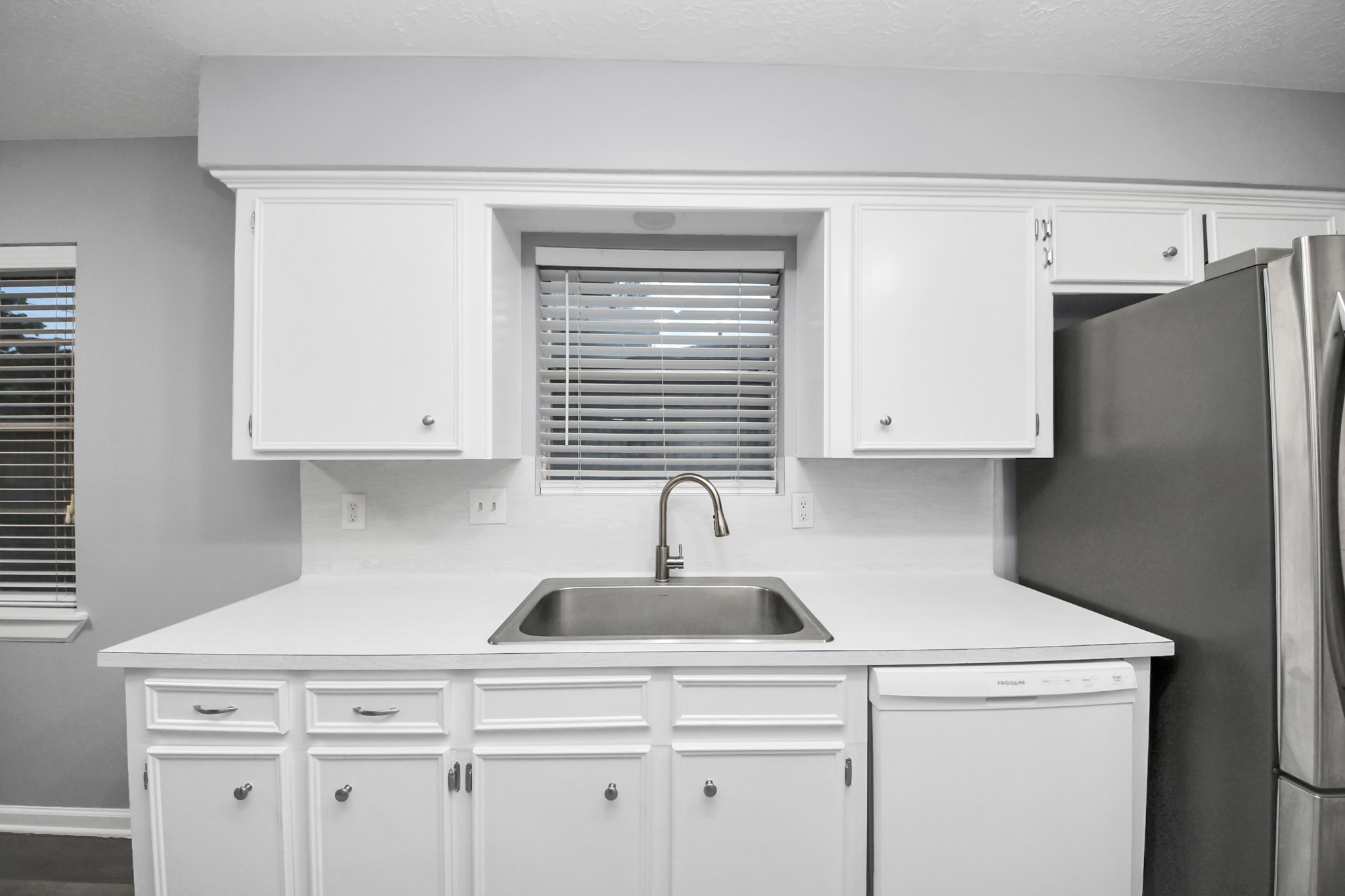 2522 Nightowl Trail Spring, TX 77373 - Photo 15 of 40 a kitchen with stainless steel appliances white cabinets and a sink