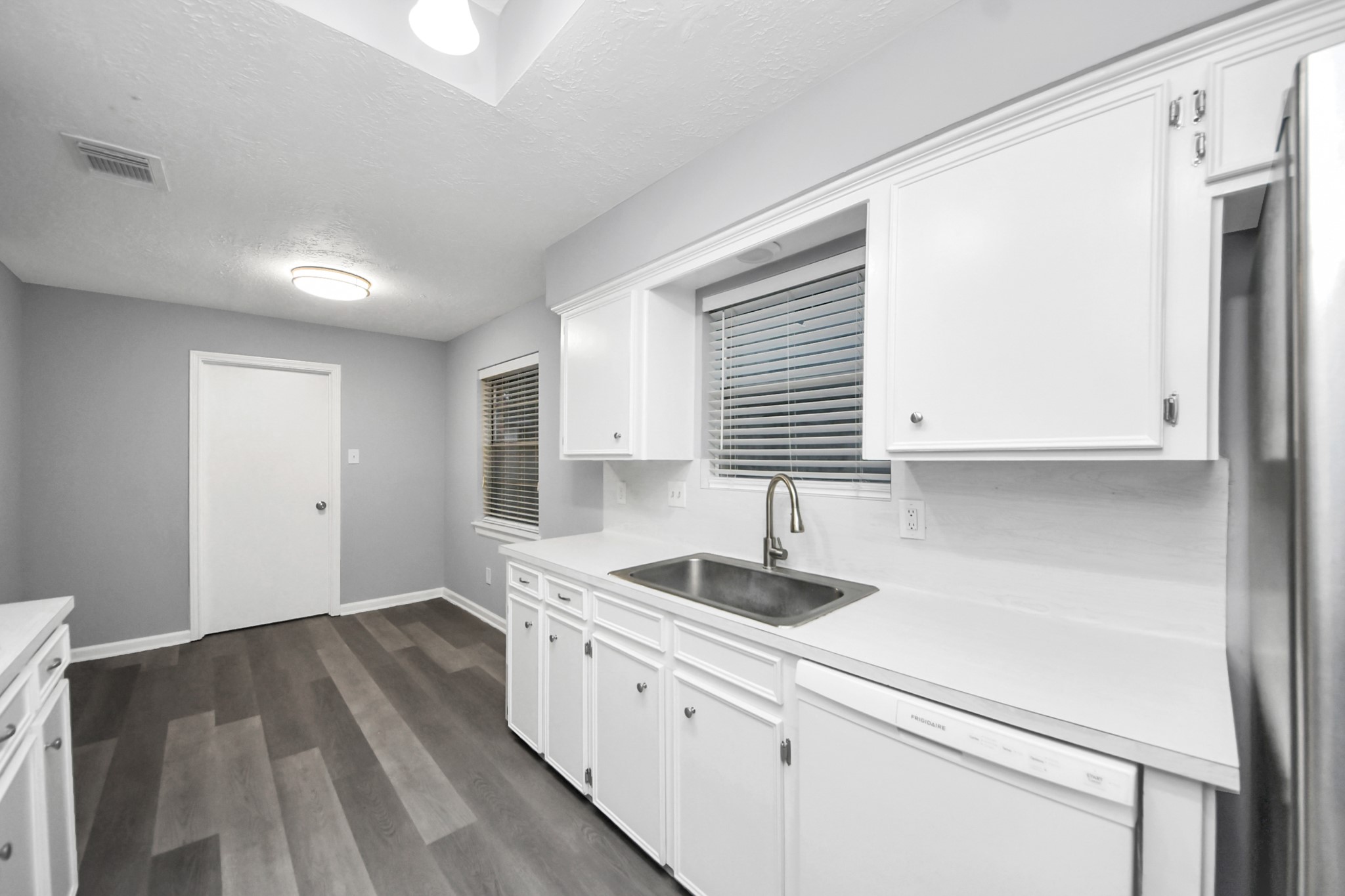 2522 Nightowl Trail Spring, TX 77373 - Photo 16 of 40 a kitchen with sink and cabinets