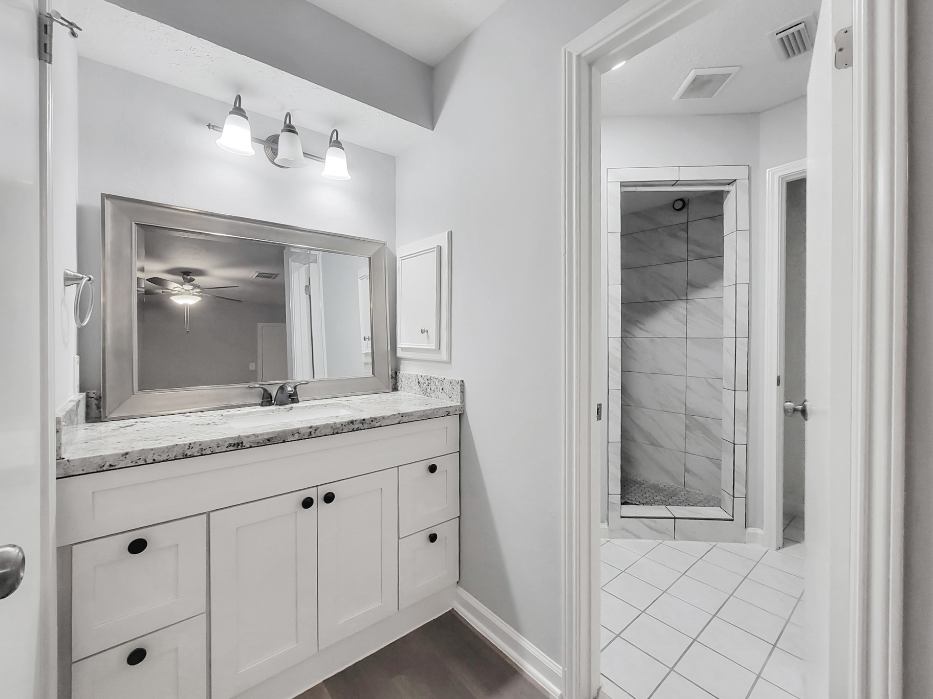 2522 Nightowl Trail Spring, TX 77373 - Photo 24 of 40 a bathroom with a granite countertop sink and a mirror