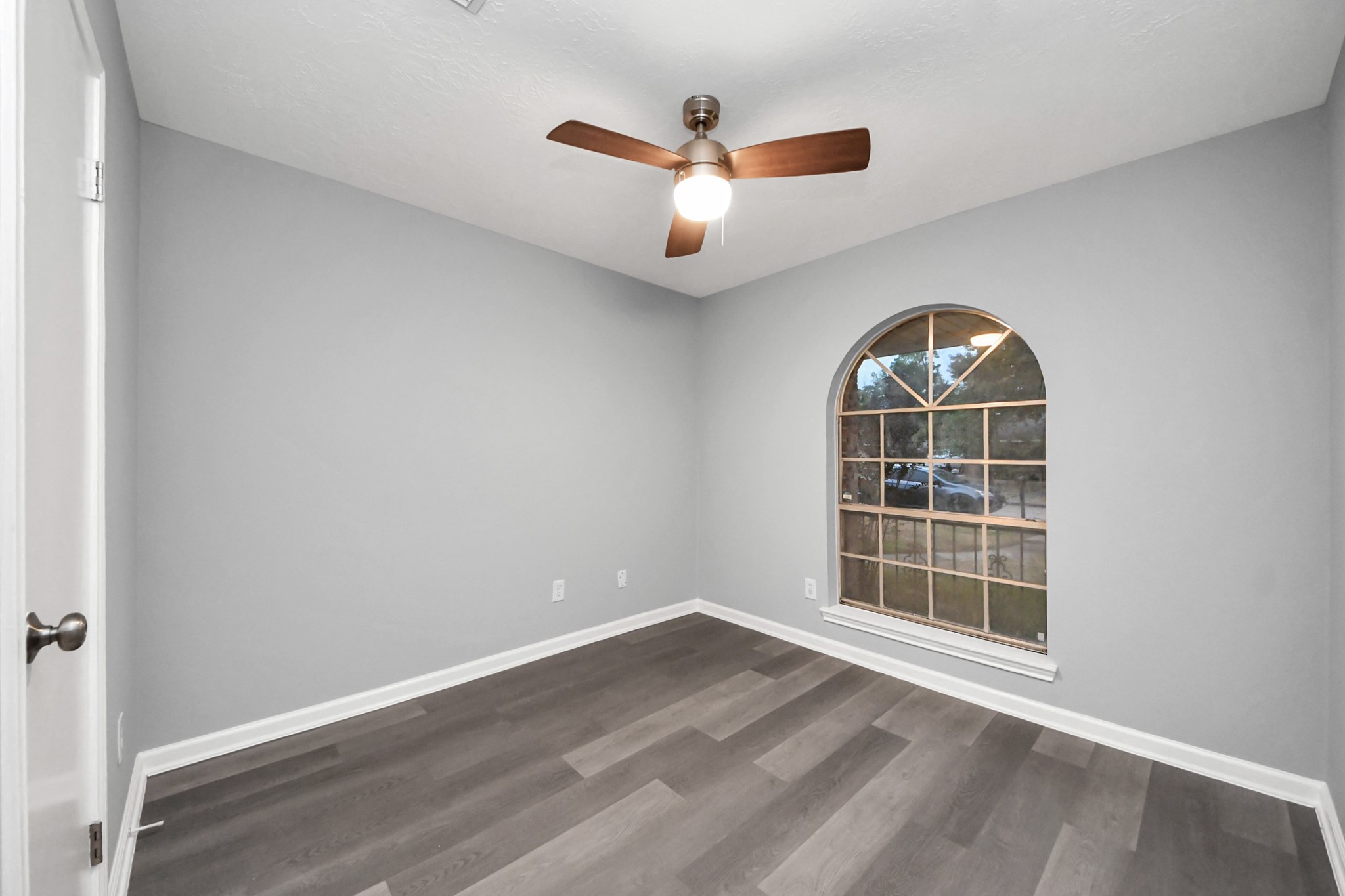 2522 Nightowl Trail Spring, TX 77373 - Photo 26 of 40 an empty room with wooden floor cabinet and windows