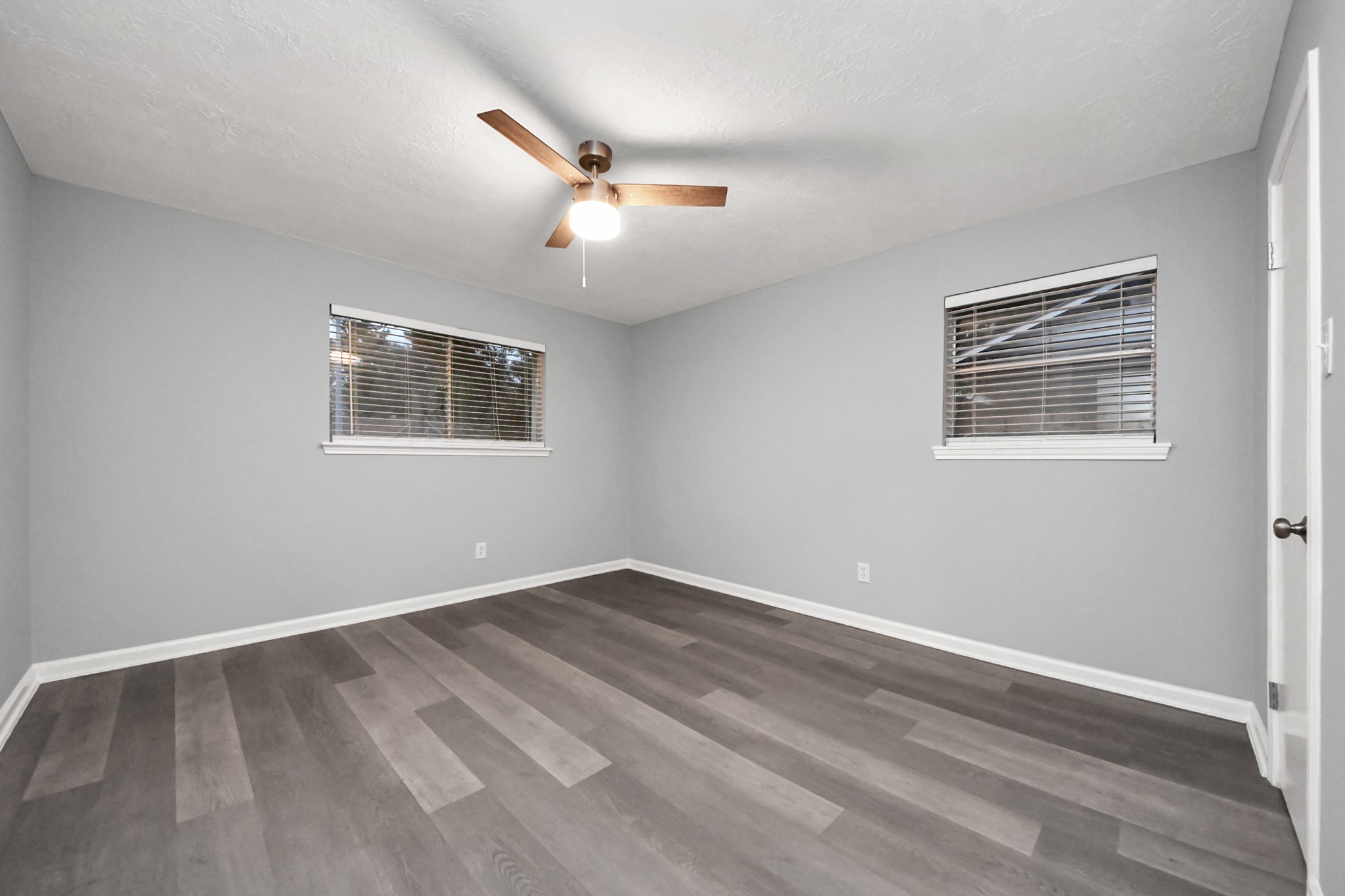 2522 Nightowl Trail Spring, TX 77373 - Photo 30 of 40 a view of an empty room with wooden floor and a window
