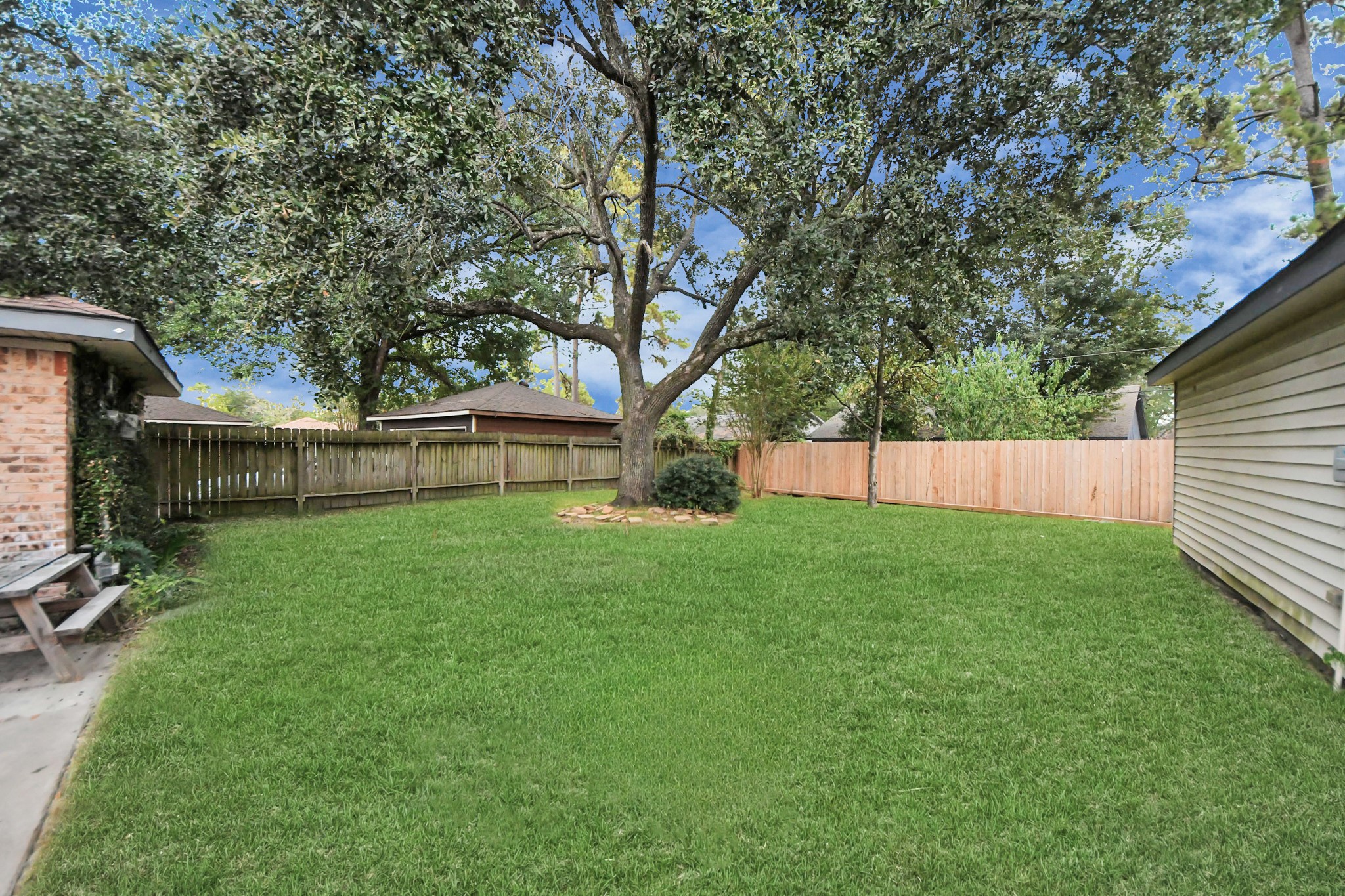 2522 Nightowl Trail Spring, TX 77373 - Photo 34 of 40 a view of backyard with wooden fence and a large tree