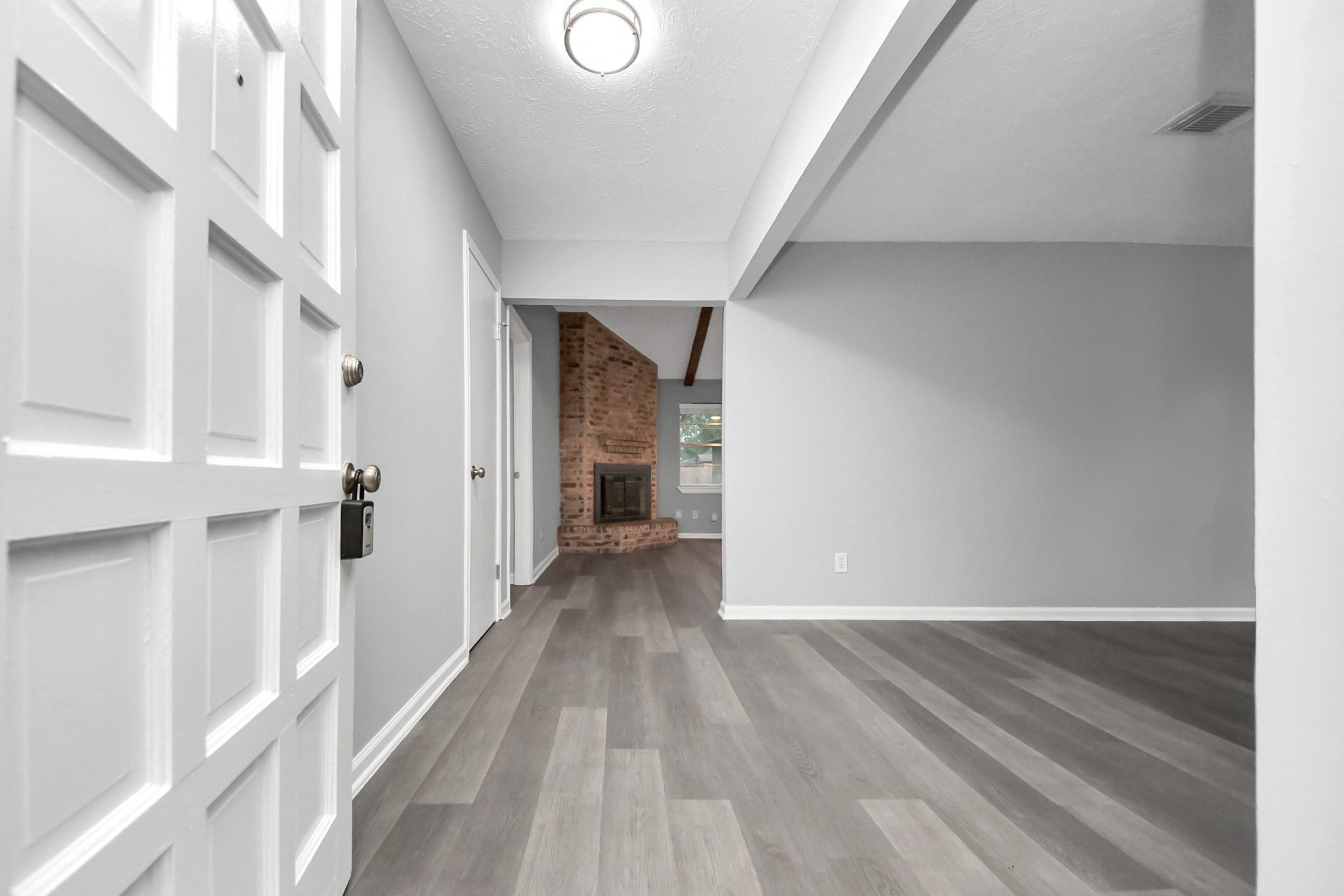 2522 Nightowl Trail Spring, TX 77373 - Photo 4 of 40 a view of a hallway with wooden floor and staircase
