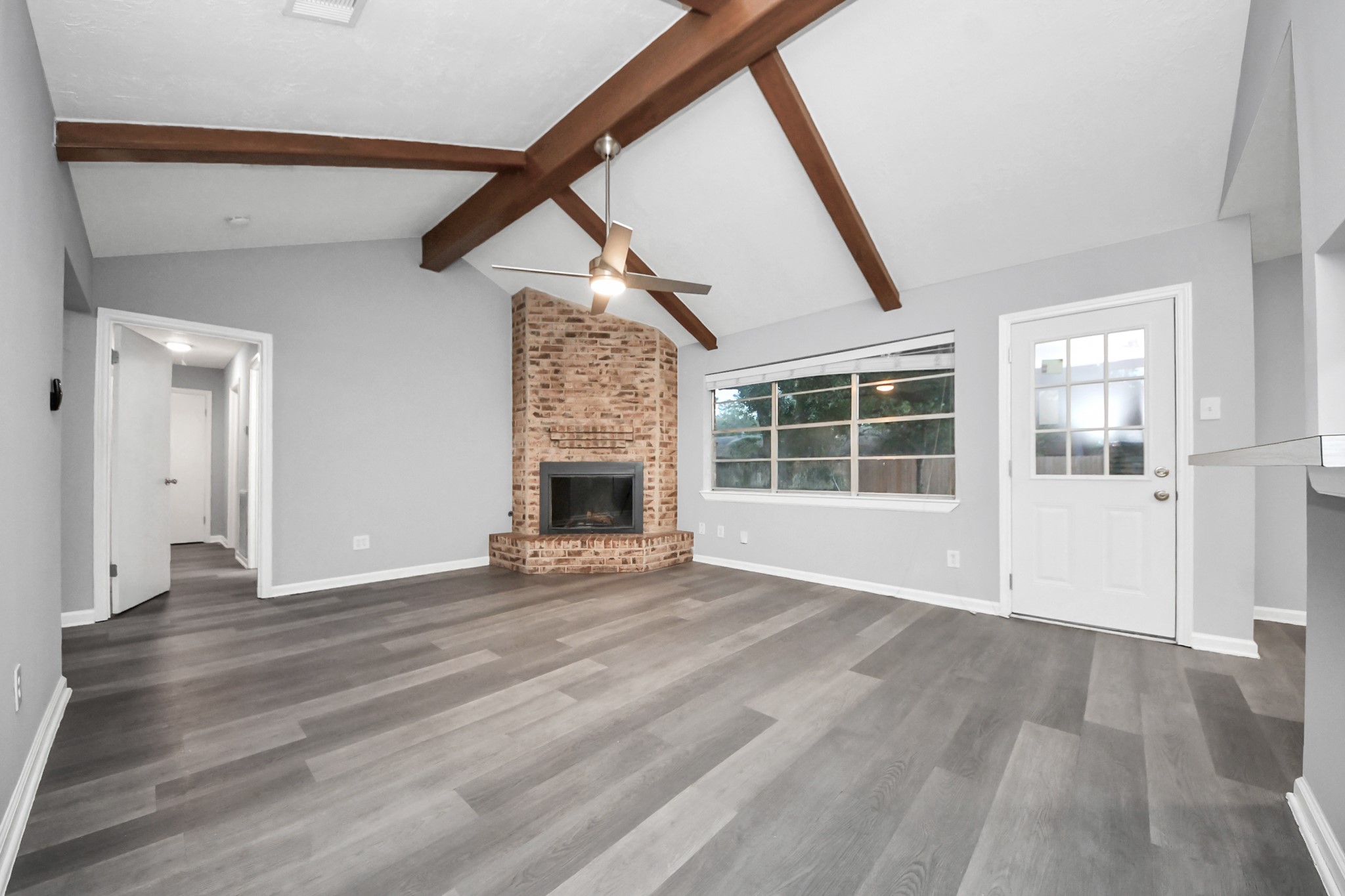 2522 Nightowl Trail Spring, TX 77373 - Photo 10 of 40 an empty room with wooden floor and windows