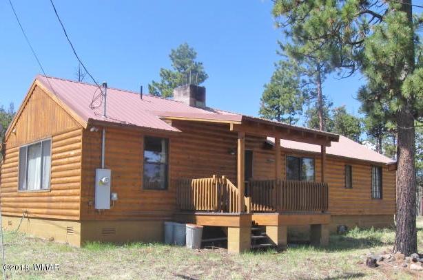 4 County Road Greer, AZ 85927 - Photo 1 of 24 a front view of a house with a yard
