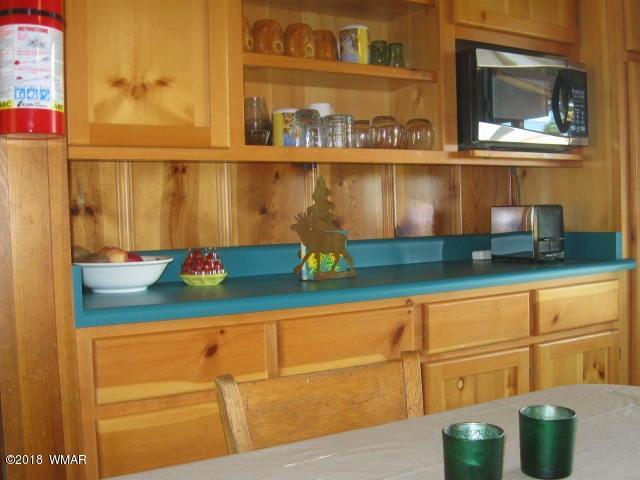 4 County Road Greer, AZ 85927 - Photo 8 of 24 a kitchen with a sink and wooden floor