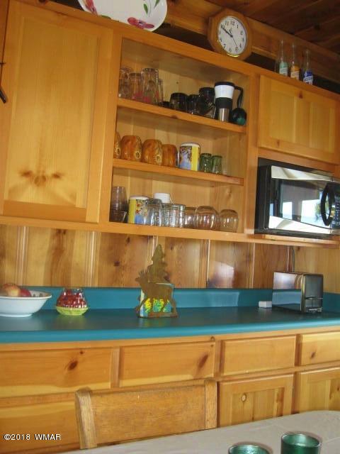 4 County Road Greer, AZ 85927 - Photo 9 of 24 a kitchen with a sink and a stove