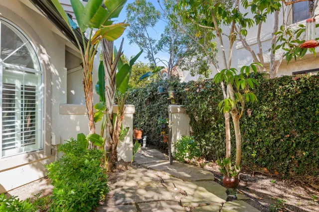a view of a house with swimming pool having outdoor seating